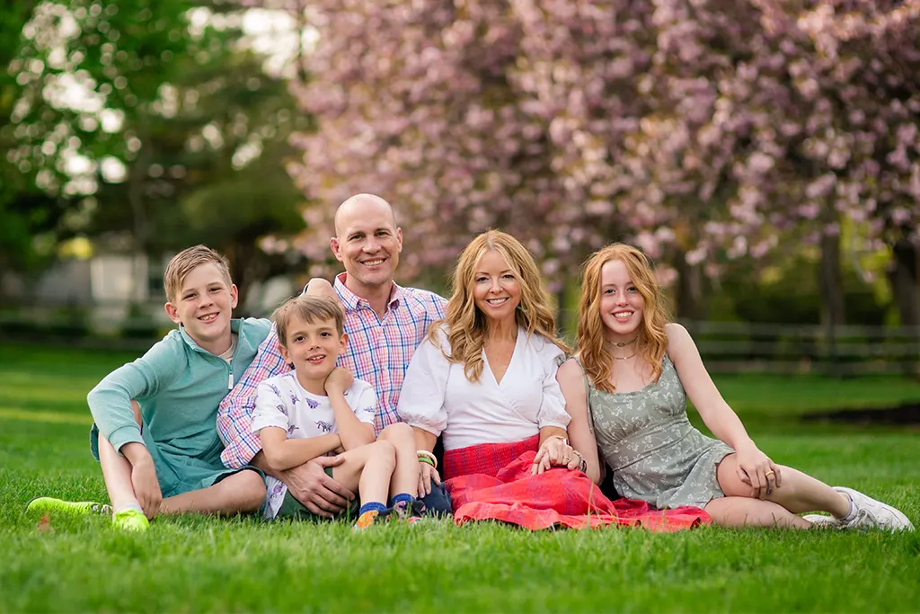 Stephanie and Jonathan Cleck family photo on the lawn